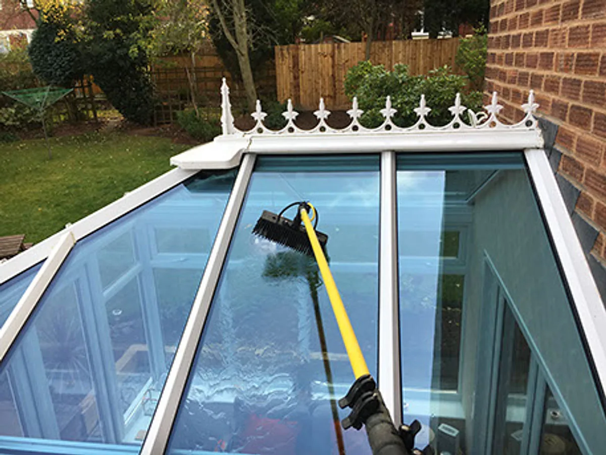 Exterior glass and frames being professionally cleaned